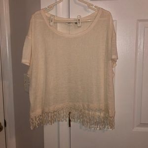 It’s white with fringe at the bottom